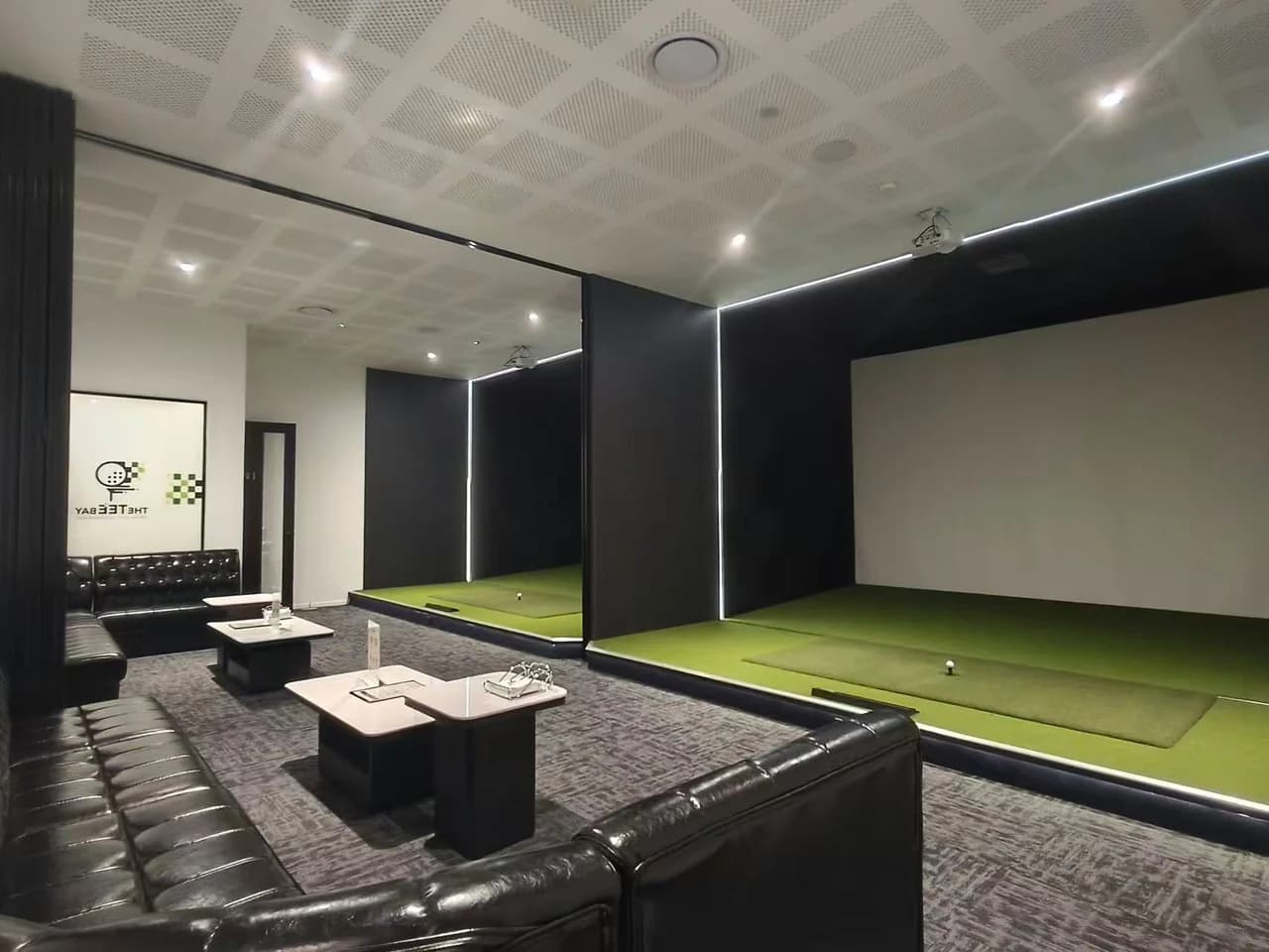 Joined VIP Rooms 3 and 4 at The Tee Bay with two golf simulators and lounge seating
